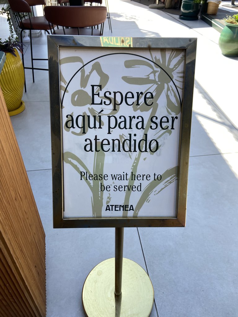 Waiting signage for customer service.