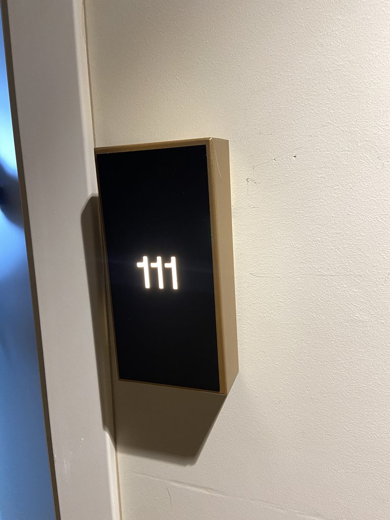 Illuminable room number signage.
