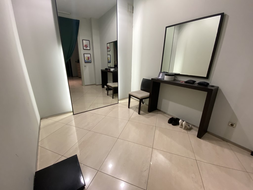 Spacious accessible fitting rooms with full-length mirrors for use by all types of users.