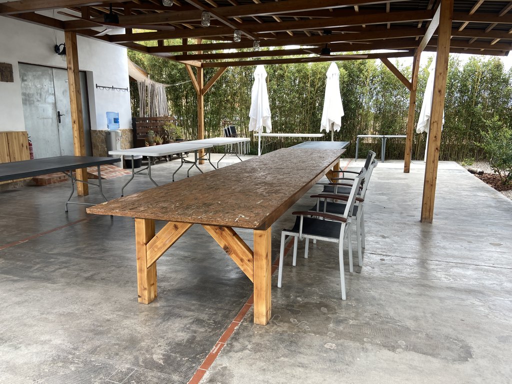 Accessible kitchen area with suitable tables for use by all types of users.