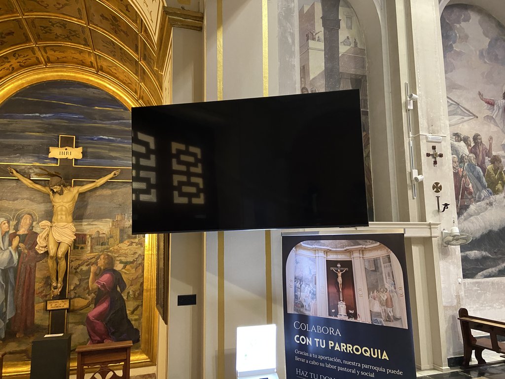 Digital screen with subtitled exhibition videos.