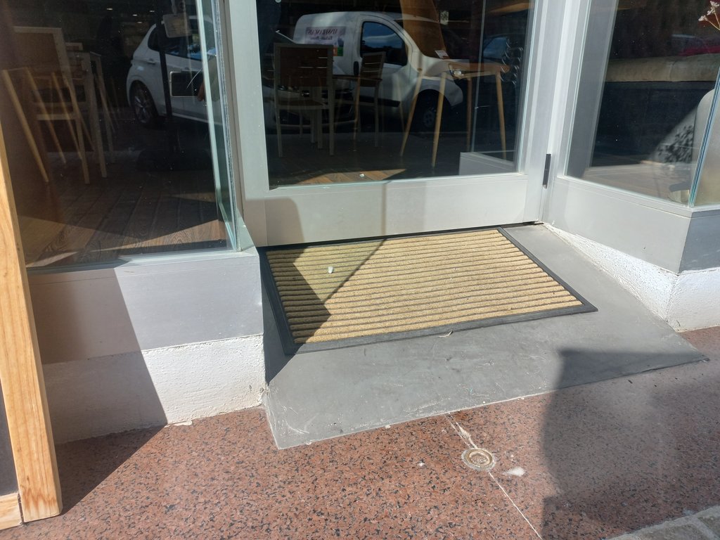 Access via ramp to overcome level difference.