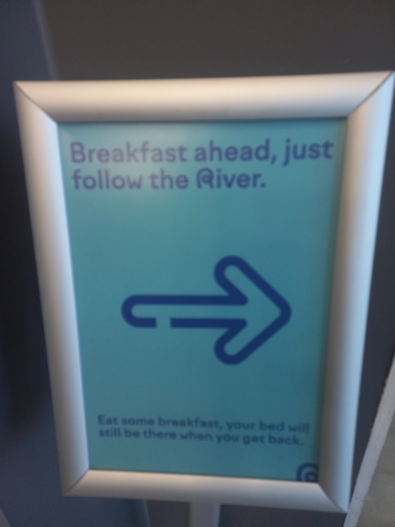 Signage composed of text and directional indicator.