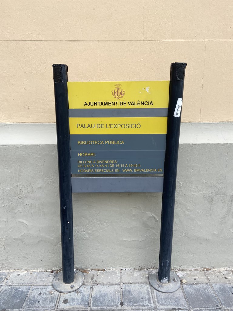 Identifying signage of the establishment next to the access door.