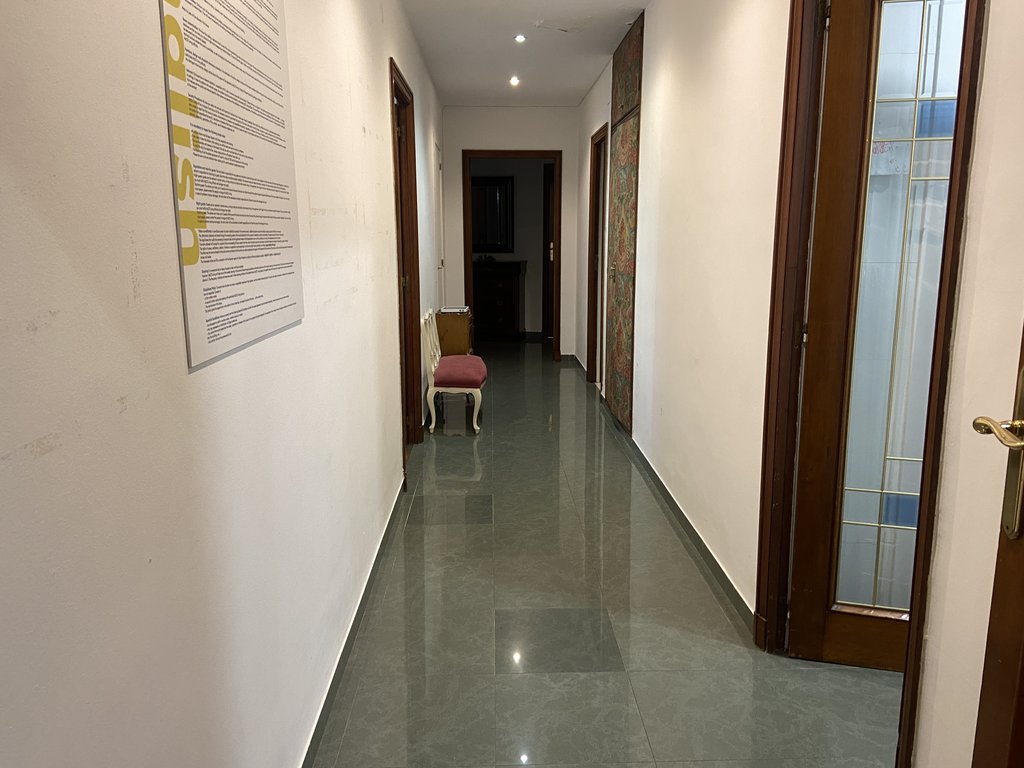 Wide passage areas between rooms.