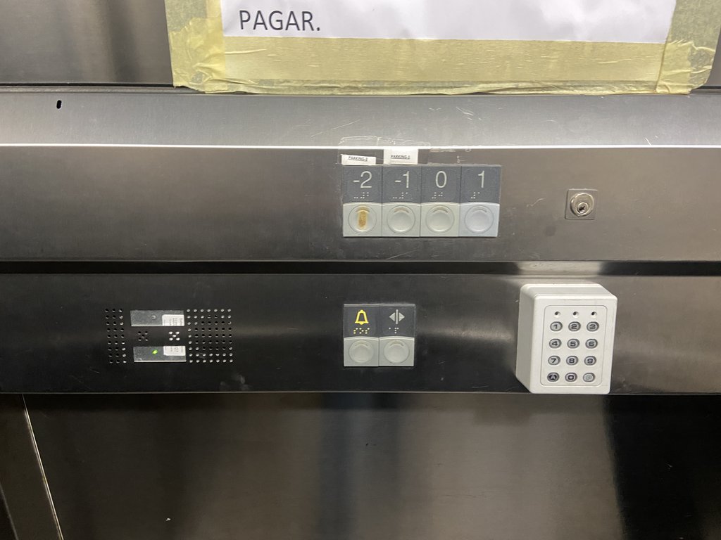 Accessible elevator with braille buttons and control panel at appropriate height.