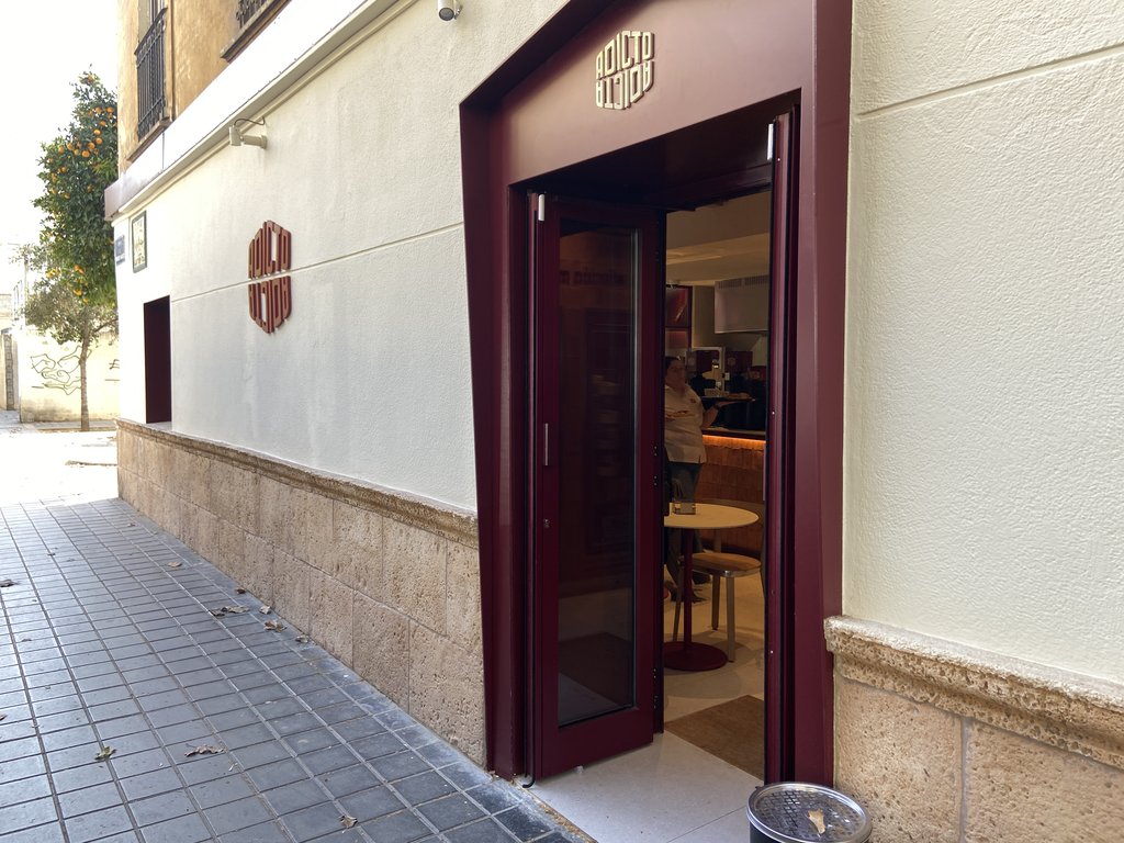 Main access to the establishment with swing doors and proper exterior accessibility.