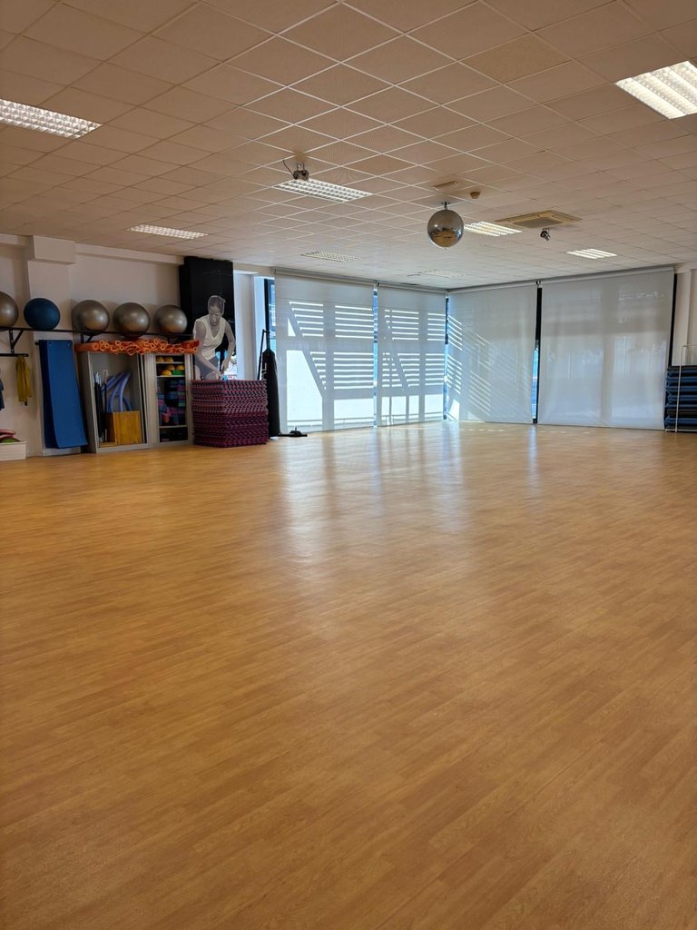 Accessible fitness room with enough space to train comfortably and properly lit.