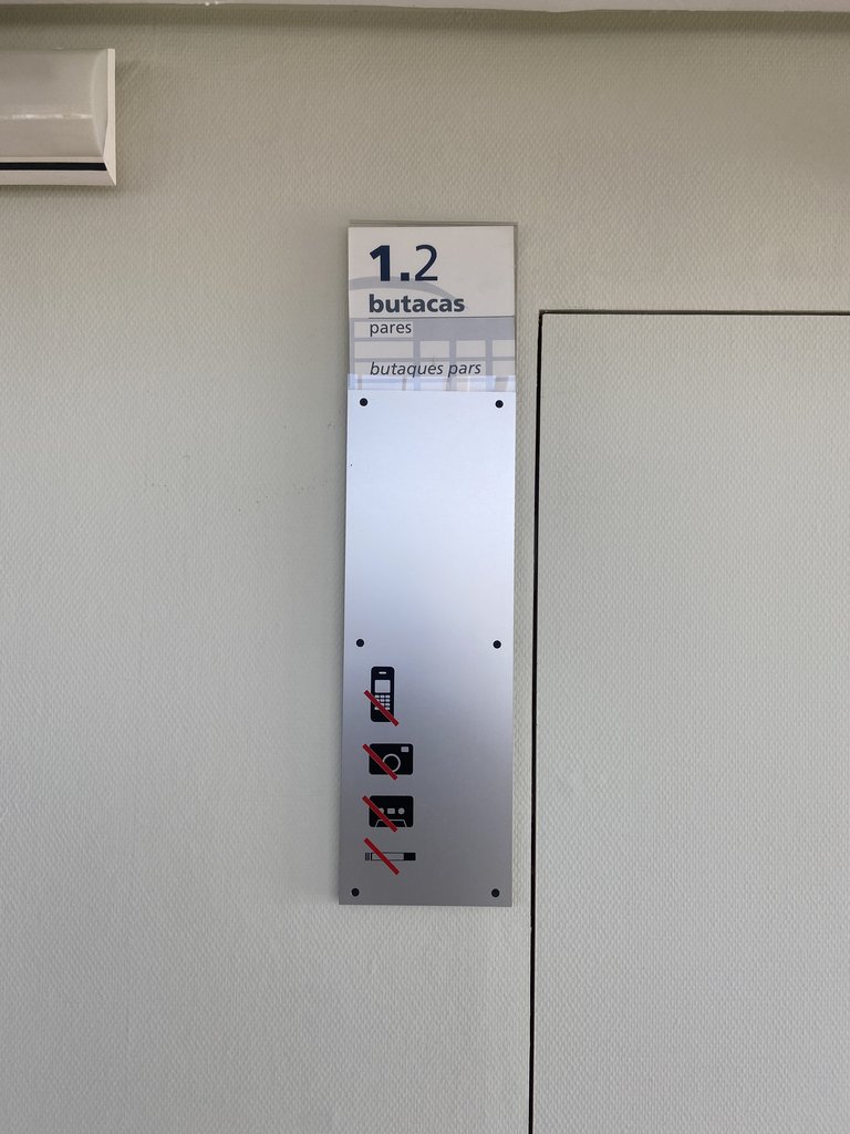 Signage for access to seating area.