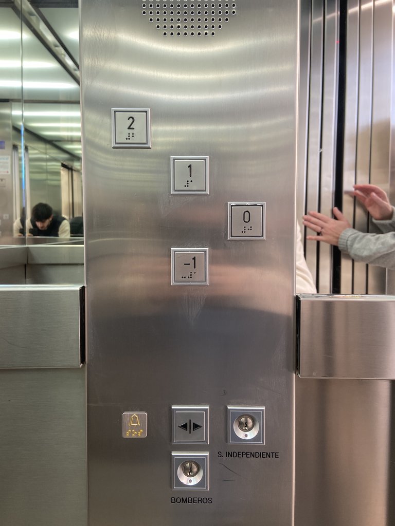 Accessible elevator with braille and illuminated buttons.
