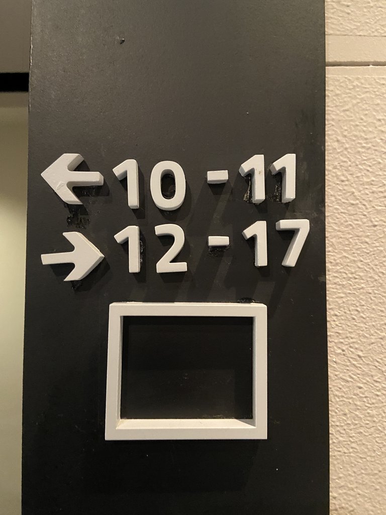 Room direction signage in high relief.