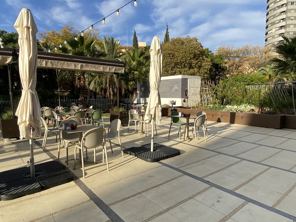 Spacious accessible outdoor terrace with accessible tables.