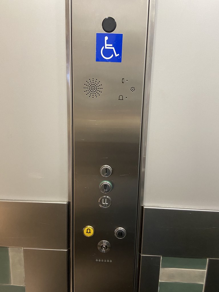 Accessible elevator with braille buttons arranged at an appropriate height.