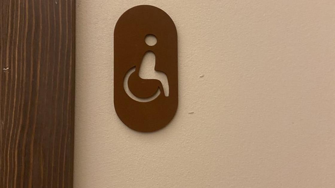 Common adapted bathroom signage.