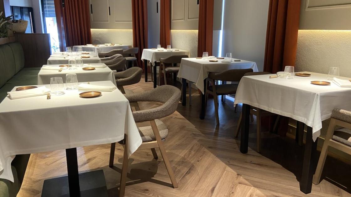 Accessible dining room with enough space between tables and proper lighting.