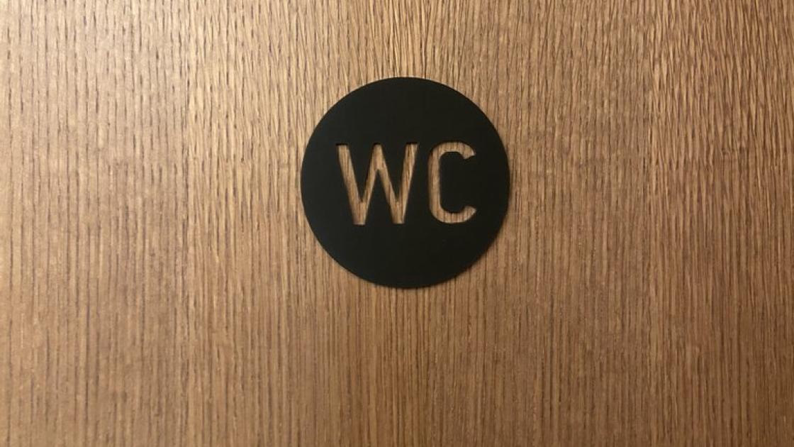 Signage for common bathrooms.
