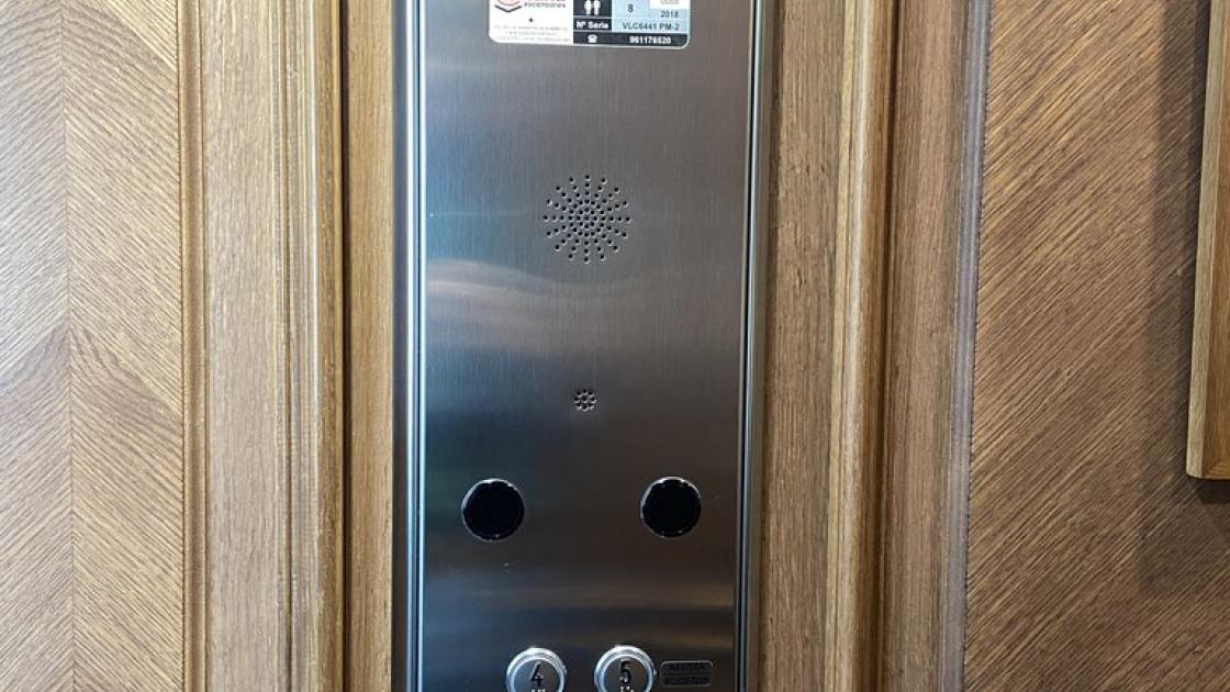 Elevator with braille buttons and suitable height.