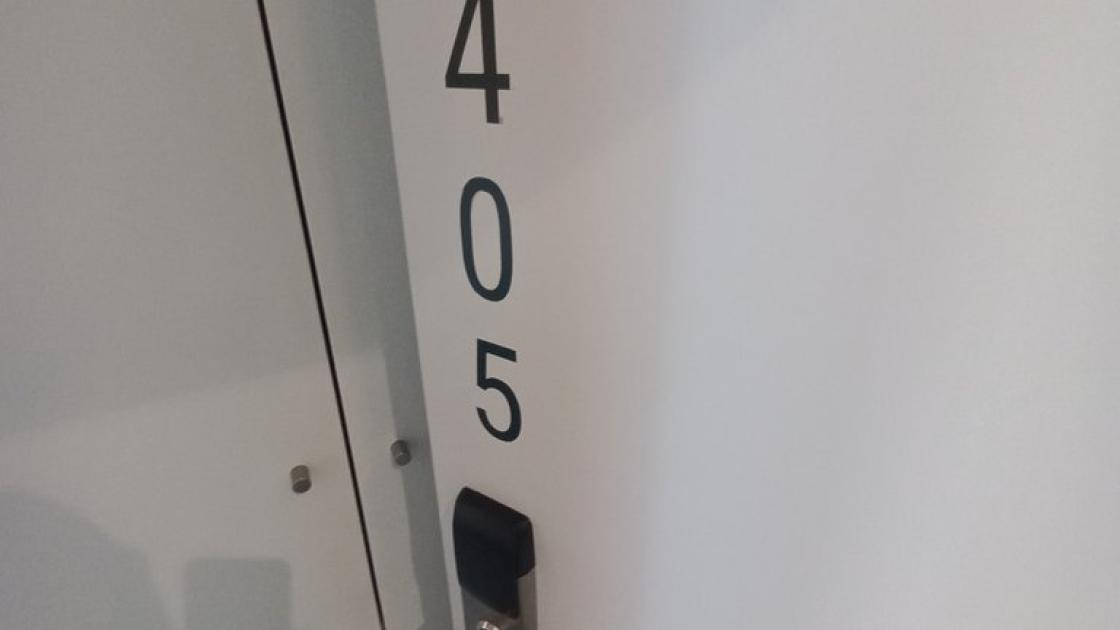 Room identification through large-format characters.