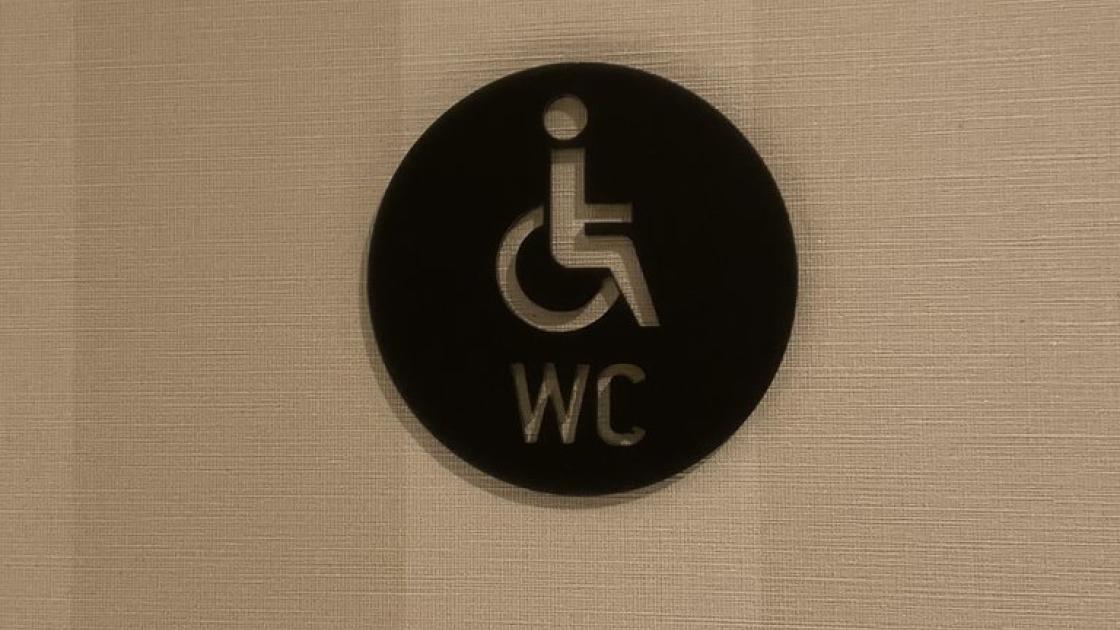 Signage for adapted bathrooms in common bathrooms.