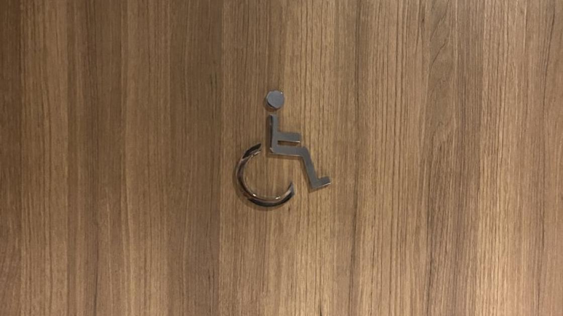 Signage for adapted common bathrooms.
