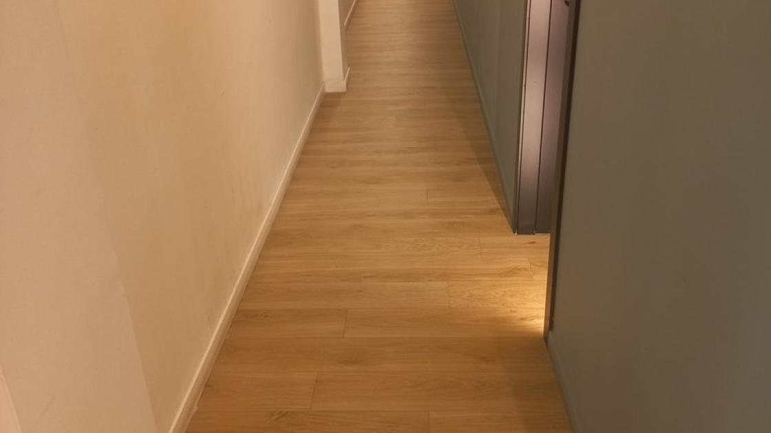 Common areas with uniform lighting and floor contrasted with vertical parameters.