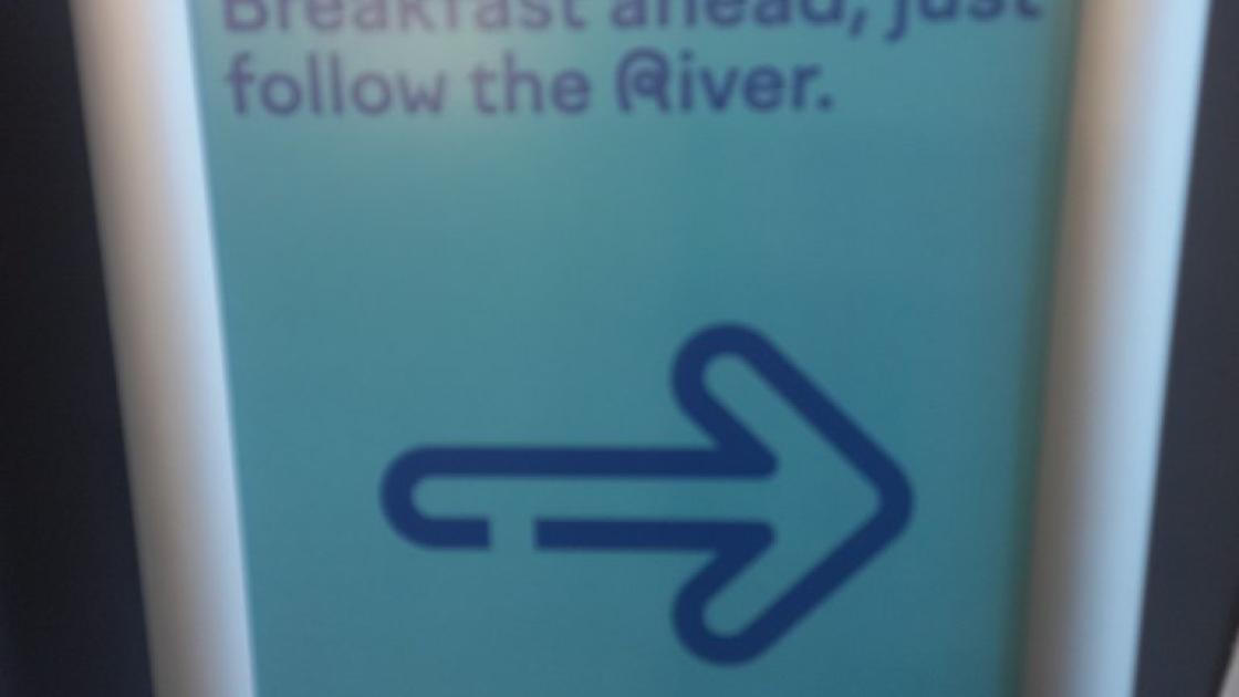 Signage composed of text and directional indicator.