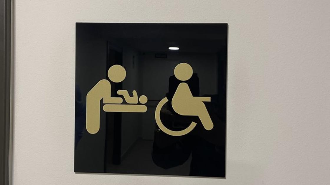 Signage for common adapted bathrooms.