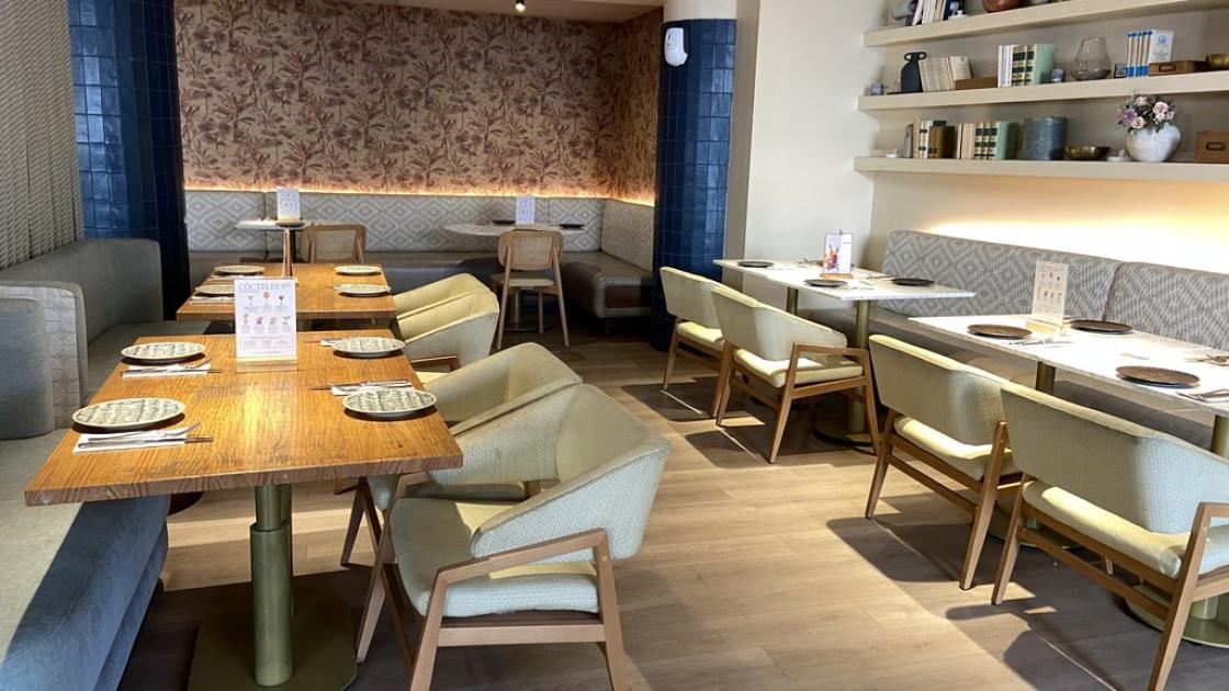 Accessible dining room with space to move around properly, accessible tables with appropriate height and proper lighting.