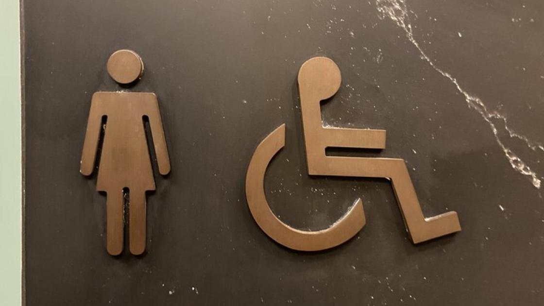 Signage for common adapted bathrooms.