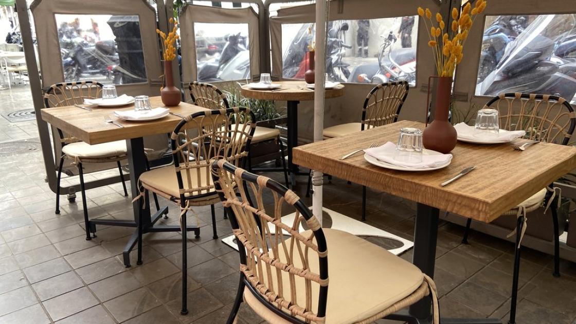 Outdoor terrace with accessible tables at appropriate height.