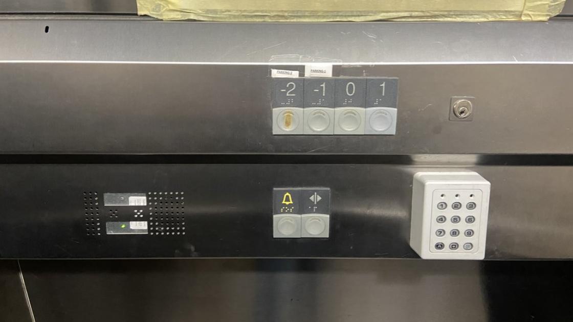 Accessible elevator with braille buttons and control panel at appropriate height.