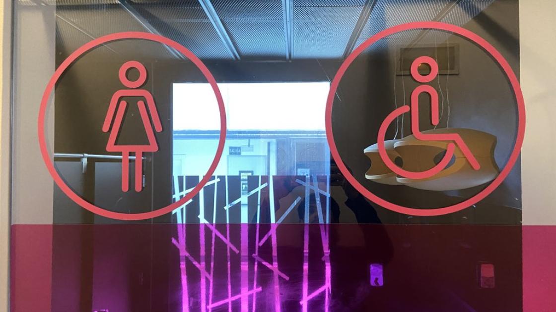 Signage for common adapted bathrooms.