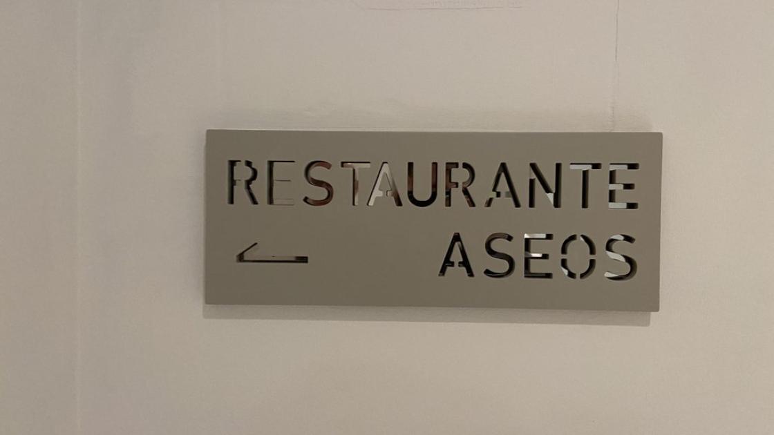 Directional signage for different spaces.