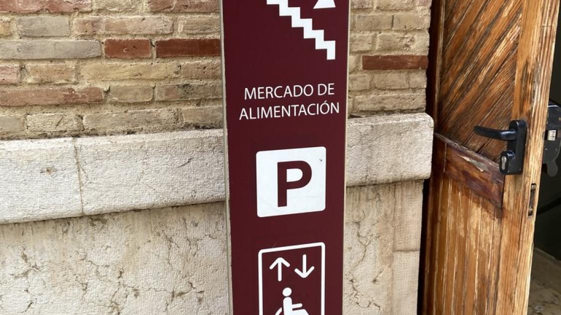 Signage for parking access, elevators, and stairs.
